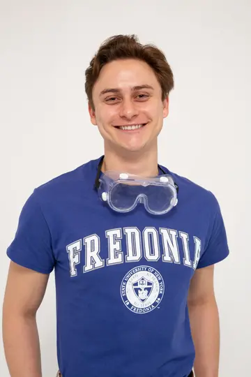 Fredonia student Hunter Burczyk smiling wearing goggles