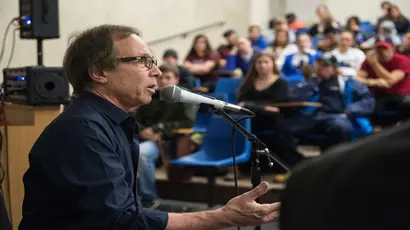 A guest speaker addresses music industry students during class where students learn about the music business degree,  music industry, and the degree in music business